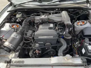 1993 Toyota Supra z VIN JZA800010229, wystawiony jako Copart lot #50000065 z przebiegiem 130 612 mil mil oraz Czysty tytuł • Clean title. Historia ofert i sprzedaży dostępna na DreamBid. Obrazek 11.