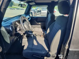 2012 Jeep Wrangler Sport with VIN 1C4AJWAG5CL273292, listed as a Copart auction lot 60135395 with 123,874 mi miles and Salvage title. Bid and sale history available at DreamBid. Image 7.
