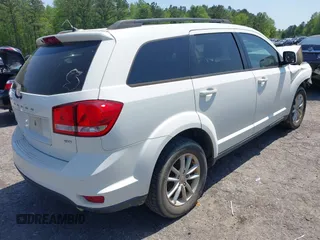 2013 Dodge Journey SXT with VIN 3C4PDCBG0DT701712, listed as a IAAI auction lot 42015263 with 92,533 mi miles. Bid and sale history available at carsss.com. Image 4.