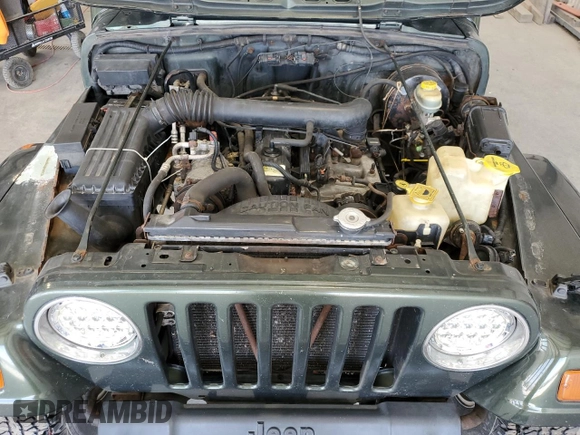1998 Jeep Wrangler Sahara z VIN 1J4FY49S4WP728476, wystawiony jako Copart lot #53490515 z przebiegiem 272 058 mil mil oraz Czysty tytuł • Clean title. Historia ofert i sprzedaży dostępna na DreamBid. Obrazek 11.