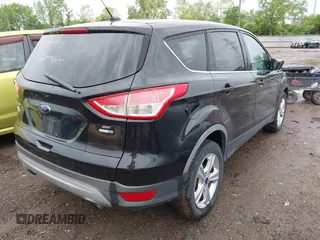 2015 Ford Escape SE with VIN 1FMCU9GX5FUB01864, listed as a IAAI auction lot 42199405 with 114,776 mi miles and . Bid and sale history available at DreamBid. Image 4.