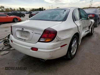 2003 Oldsmobile Aurora z VIN 1G3GS64C834100084, wystawiony jako Copart lot #76966704 z przebiegiem 70 263 mil mil oraz Szkody całkowita. Historia ofert i sprzedaży dostępna na DreamBid. Obrazek 3.