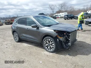 2020 Ford Escape Titanium Hybrid z VIN 1FMCU9DZ6LUA51042, wystawiony jako IAAI lot #42041859 z przebiegiem 118 731 mil mil oraz . Historia ofert i sprzedaży dostępna na DreamBid. Obrazek 1.