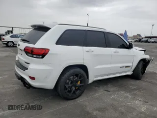 2018 Jeep Grand Cherokee Trackhawk with VIN 1C4RJFN91JC293695, listed as a Copart auction lot 59031525 with 8,565 mi miles and Salvage title. Bid and sale history available at DreamBid. Image 3.