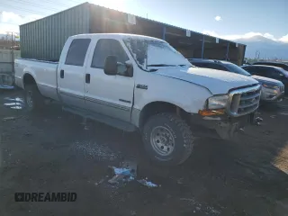 2000 Ford F-350 XL with VIN 1FTSW31F8YEA82117, listed as a Copart auction lot 82800154 with 236,161 mi miles and Salvage Title. Bid and sale history available at DreamBid. Image 4.
