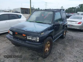 1995 Geo Tracker z VIN 2CNBE18U0S6943292, wystawiony jako IAAI lot #41274067 z przebiegiem Nie podano mil oraz . Historia ofert i sprzedaży dostępna na DreamBid. Obrazek 1.
