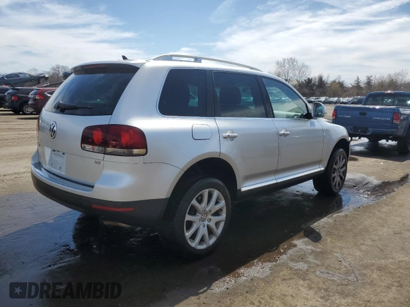 2010 Volkswagen Touareg VR6 with VIN WVGBF7A97AD004355, listed as a Copart auction lot 52861335 with 129,454 mi miles and Salvage Title. Bid and sale history available at DreamBid. Image 3.