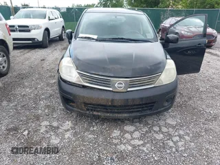2009 Nissan Versa 1.8 S with VIN 3N1BC13E79L354341, listed as a IAAI auction lot 42079896 with 118,797 mi miles. Bid and sale history available at carsss.com. Image 6.