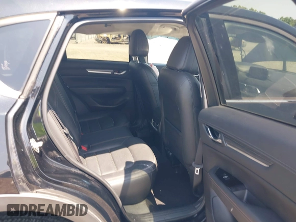 2020 Mazda CX-5 Grand Touring with VIN JM3KFADM9L1837183, listed as a IAAI auction lot 42340628 with 81,975 mi miles and . Bid and sale history available at DreamBid. Image 8.