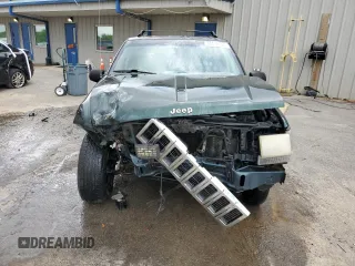 1995 Jeep Grand Cherokee Laredo with VIN 1J4FX58S8SC773884, listed as a Copart auction lot 56572555 with 424,126 mi miles and Salvage title. Bid and sale history available at DreamBid. Image 5.
