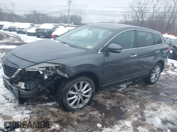 2014 Mazda CX-9 Grand Touring with VIN JM3TB3DV9E0440506, listed as a IAAI auction lot 41537718 with 217,299 mi miles and . Bid and sale history available at DreamBid. Image 2.