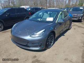 2020 Tesla Model 3 Standard Range Plus with VIN 5YJ3E1EA2LF634566, listed as a IAAI auction lot 41880994 with 65,395 mi miles. Bid and sale history available at carsss.com. Image 2.