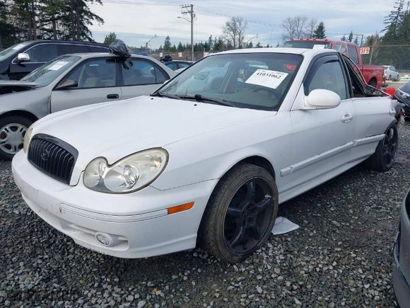 2004 Hyundai Sonata GLS with VIN KMHWF35H94A014600, listed as a IAAI auction lot 41031062 with 128,512 mi miles. Bid and sale history available at carsss.com. Image 2.