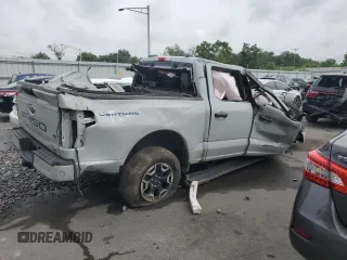 2023 Ford F-150 Lightning Pro with VIN 1FTVW1EL9PWG58758, listed as a Copart auction lot 64410814 with Not provided miles and Salvage title. Bid and sale history available at DreamBid. Image 3.