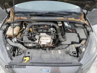 2018 Ford Focus SE z VIN 1FADP3FE1JL220741, wystawiony jako Copart lot #53755735 z przebiegiem Nie podano mil oraz Czysty tytuł • Clean title. Historia ofert i sprzedaży dostępna na DreamBid. Obrazek 11.