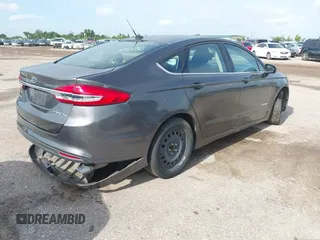 2017 Ford Fusion Hybrid SE with VIN 3FA6P0LU5HR336779, listed as a IAAI auction lot 42691789 with 140,720 mi miles and . Bid and sale history available at DreamBid. Image 4.
