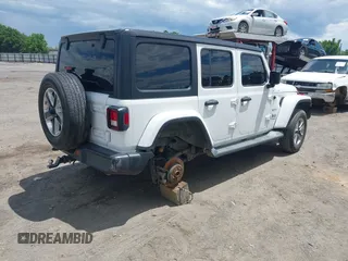 2019 Jeep Wrangler Unlimited Sahara with VIN 1C4HJXEN7KW535887, listed as a IAAI auction lot 42217440 with 91,226 mi miles and . Bid and sale history available at DreamBid. Image 4.