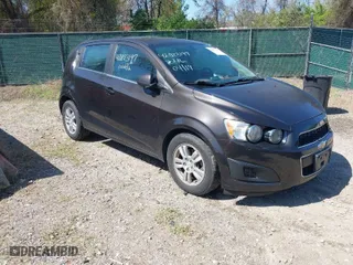 2014 Chevrolet Sonic LT with VIN 1G1JC6SB6E4210561, listed as a IAAI auction lot 42073197 with 100,945 mi miles. Bid and sale history available at carsss.com. Image 1.