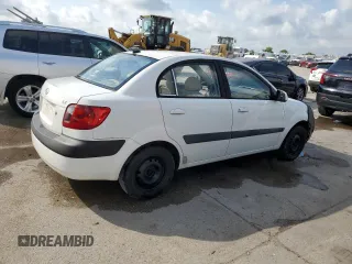 2009 Kia Rio LX with VIN KNADE223X96439445, listed as a Copart auction lot 54619335 with 102,120 mi miles and Salvage Title. Bid and sale history available at DreamBid. Image 3.