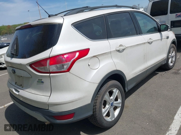 2013 Ford Escape SE with VIN 1FMCU9GXXDUD63179, listed as a IAAI auction lot 42017993 with 72,410 mi miles. Bid and sale history available at carsss.com. Image 4.
