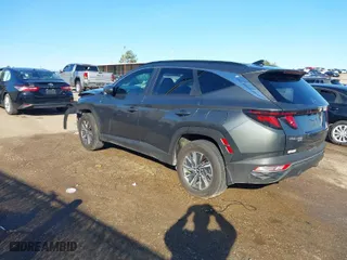 2024 Hyundai Tucson Hybrid Blue with VIN KM8JBCD11RU143446, listed as a IAAI auction lot 41305834 with 30,559 mi miles. Bid and sale history available at carsss.com. Image 3.