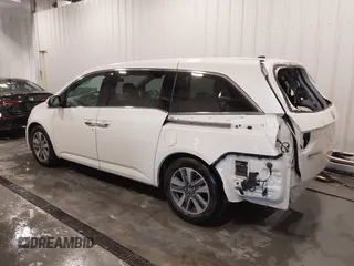 2015 Honda Odyssey Touring Elite with VIN 5FNRL5H92FB020159, listed as a IAAI auction lot 42103240 with 79,322 mi miles and . Bid and sale history available at DreamBid. Image 3.