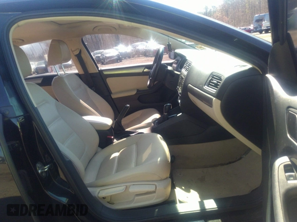 2016 Volkswagen Jetta Sedan 1.4T SE with VIN 3VWD67AJXGM242539, listed as a IAAI auction lot 38948493 with 121,876 mi miles. Bid and sale history available at carsss.com. Image 5.