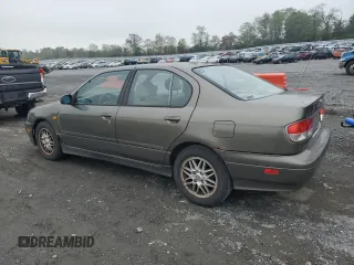 2000 Infiniti G20 Luxury z VIN JNKCP11A1YT304887, wystawiony jako Copart lot #74562724 z przebiegiem 202 140 mil mil oraz Czysty tytuł • Clean title. Historia ofert i sprzedaży dostępna na DreamBid. Obrazek 2.