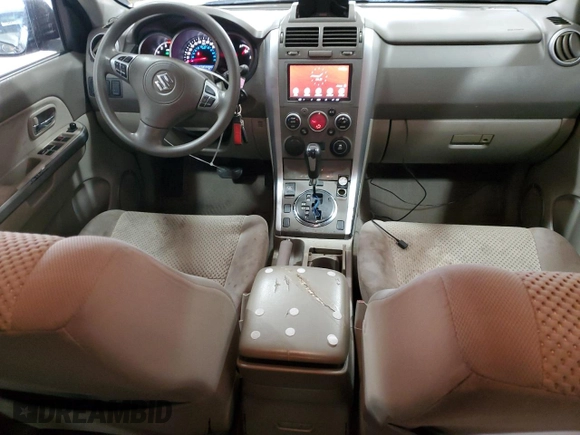 2012 Suzuki Grand Vitara Premium z VIN JS3TD0D66C4100814, wystawiony jako Copart lot #89250025 z przebiegiem 102 381 mil mil oraz Szkody całkowita. Historia ofert i sprzedaży dostępna na DreamBid. Obrazek 8.