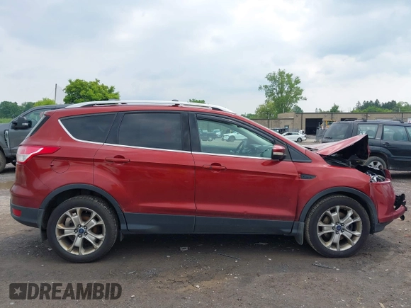 2015 Ford Escape Titanium z VIN 1FMCU9J98FUC84963, wystawiony jako IAAI lot #42469112 z przebiegiem 128 838 mil mil oraz . Historia ofert i sprzedaży dostępna na DreamBid. Obrazek 13.