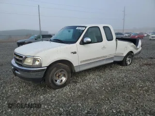 1997 Ford F-150 with VIN 1FTDX1728VNC50512, listed as a Copart auction lot 86523634 with 186,533 mi miles and Salvage title. Bid and sale history available at DreamBid. Image 1.