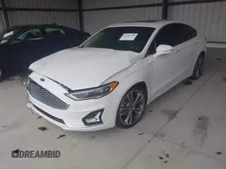 2019 Ford Fusion Titanium with VIN 3FA6P0K95KR271291, listed as a IAAI auction lot 41983320 with 71,962 mi miles and . Bid and sale history available at DreamBid. Image 2.