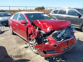2014 Cadillac XTS Luxury z VIN 2G61M5S35E9297781, wystawiony jako IAAI lot #41765330 z przebiegiem 149 770 mil mil oraz . Historia ofert i sprzedaży dostępna na DreamBid. Obrazek 1.