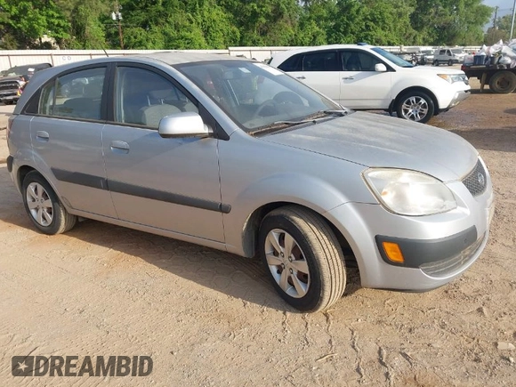 2009 Kia Rio LX with VIN KNADE243896483683, listed as a IAAI auction lot 42061404 with 88,614 mi miles. Bid and sale history available at carsss.com. Image 1.