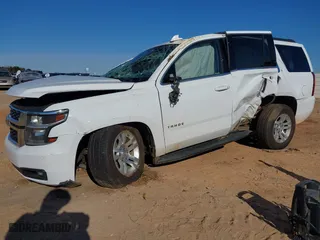 2020 Chevrolet Tahoe LT with VIN 1GNSKBKC1LR264762, listed as a IAAI auction lot 41037026 with 95,644 mi miles. Bid and sale history available at carsss.com. Image 2.