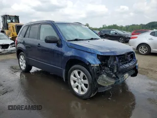 2012 Suzuki Grand Vitara Limited with VIN JS3TD0D74C4100125, listed as a Copart auction lot 58935355 with 218,085 mi miles and Salvage title. Bid and sale history available at DreamBid. Image 4.