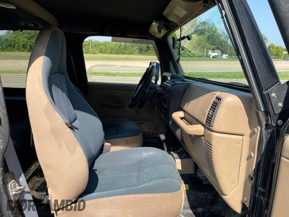 1999 Jeep Wrangler Sahara with VIN 1J4FY49S5XP496486, listed as a Copart auction lot 77263014 with 128,498 mi miles and Clean Title. Bid and sale history available at carsss.com. Image 5.