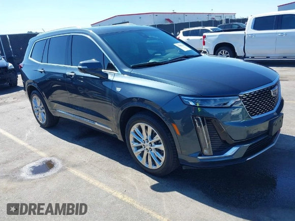 2021 Cadillac XT6 Premium Luxury with VIN 1GYKPERS0MZ110029, listed as a IAAI auction lot 41669104 with 58,890 mi miles and . Bid and sale history available at DreamBid. Image 1.