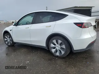 2023 Tesla Model Y Long Range z VIN 7SAYGAEE5PF743079, wystawiony jako Copart lot #45570655 z przebiegiem 46 145 mil mil oraz Szkoda całkowita • Salvage title. Historia ofert i sprzedaży dostępna na DreamBid. Obrazek 2.