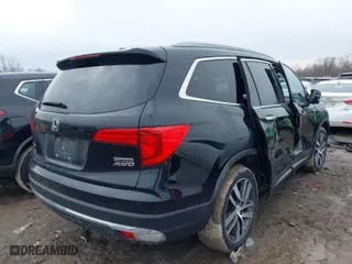 2017 Honda Pilot Touring with VIN 5FNYF6H97HB078487, listed as a IAAI auction lot 41676341 with 105,176 mi miles. Bid and sale history available at carsss.com. Image 4.