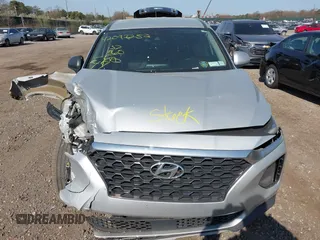 2019 Hyundai Santa Fe SE with VIN 5NMS23AD3KH102739, listed as a IAAI auction lot 42097252 with 116,023 mi miles and . Bid and sale history available at DreamBid. Image 12.
