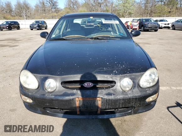 2001 Kia Spectra GS z VIN KNAFB161115036033, wystawiony jako Copart lot #55939335 z przebiegiem 76 414 mil mil oraz Szkoda całkowita • Salvage title. Historia ofert i sprzedaży dostępna na DreamBid. Obrazek 5.
