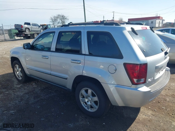 2010 Jeep Grand Cherokee Laredo with VIN 1J4PR4GK5AC161442, listed as a IAAI auction lot 41939994 with 137,376 mi miles. Bid and sale history available at carsss.com. Image 3.