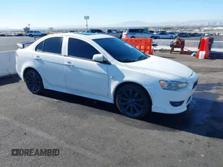 2009 Mitsubishi Lancer GTS with VIN JA3AU86W89U009617, listed as a IAAI auction lot 41409767 with 215,559 mi miles. Bid and sale history available at carsss.com. Image 1.
