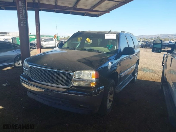 2005 GMC Yukon SLT with VIN 1GKEC13T35J185918, listed as a IAAI auction lot 41025720 with 162,613 mi miles. Bid and sale history available at carsss.com. Image 2.