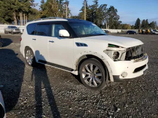 2012 Infiniti QX56 7-passenger with VIN JN8AZ2NE1C9021857, listed as a Copart auction lot 76967164 with 153,958 mi miles and Salvage Title. Bid and sale history available at carsss.com. Image 4.