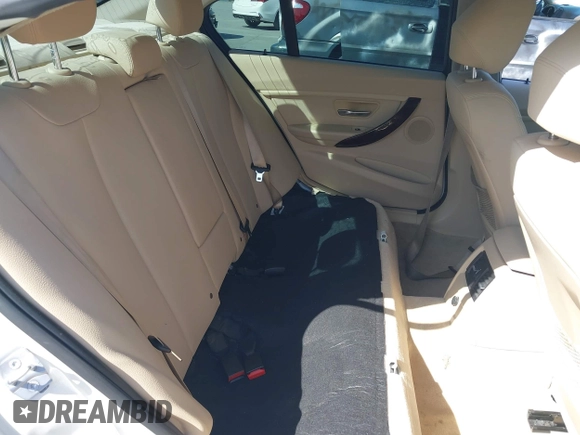 2014 BMW 3 Series 320i with VIN WBA3B1G50ENN90657, listed as a IAAI auction lot 42304612 with 129,377 mi miles and . Bid and sale history available at DreamBid. Image 8.