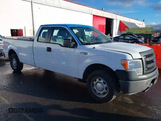 2014 Ford F-150 XL with VIN 1FTFX1CF4EKG53325, listed as a IAAI auction lot 41060015 with 216,554 mi miles. Bid and sale history available at carsss.com. Image 1.
