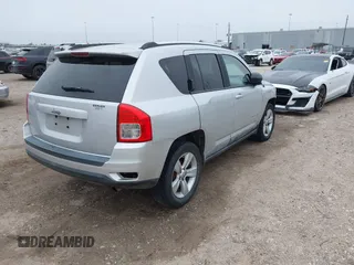 2011 Jeep Compass with VIN 1J4NT1FA7BD142600, listed as a IAAI auction lot 41590661 with 266,600 mi miles. Bid and sale history available at carsss.com. Image 4.