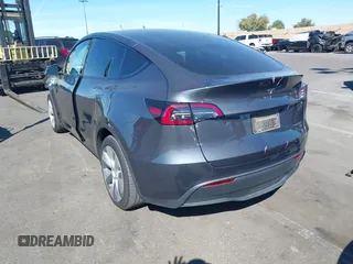 2023 Tesla Model Y Long Range with VIN 7SAYGAEE8PF976969, listed as a IAAI auction lot 41877784 with 25,896 mi miles. Bid and sale history available at carsss.com. Image 3.